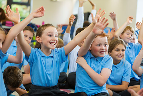 Excited children in the classroom