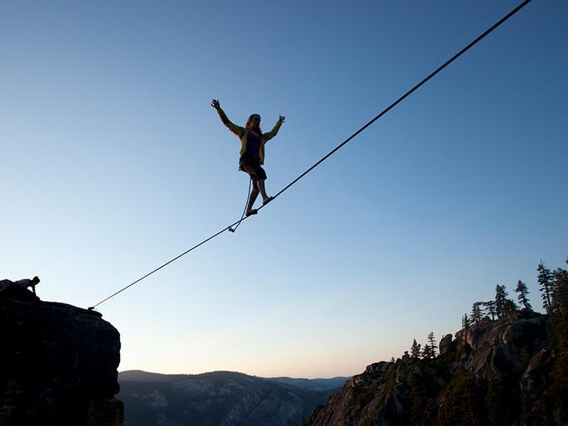 A person high up on a tightrope