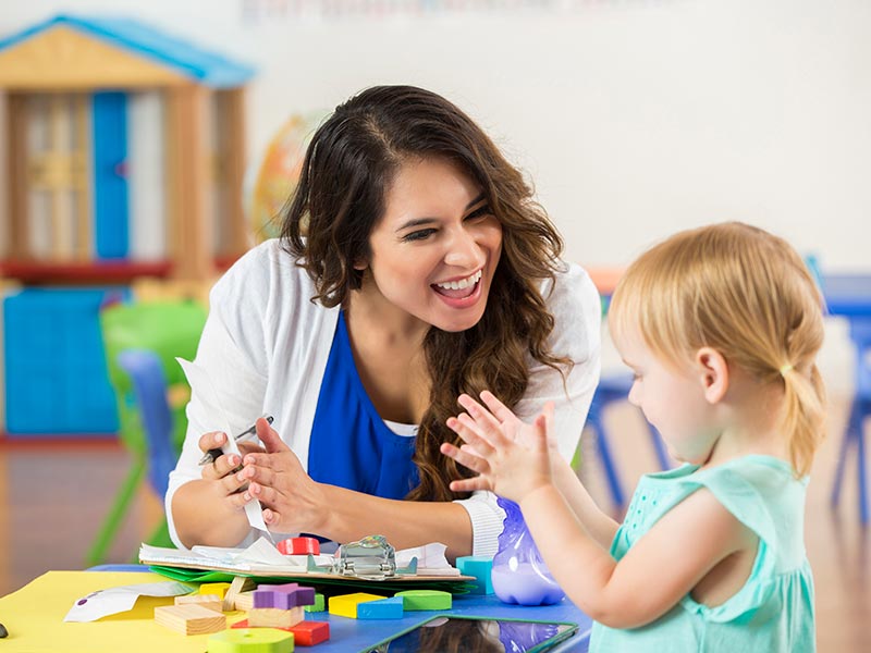 A child and their teacher