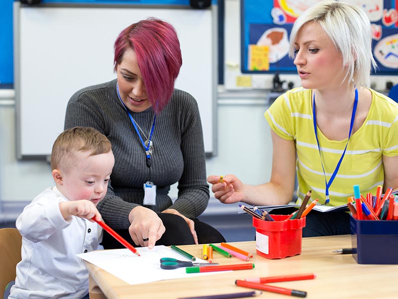 A young child with Down's Syndrome at nursery