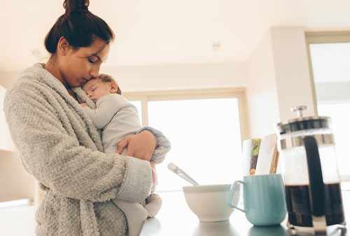 Sleeping baby in mother's arms